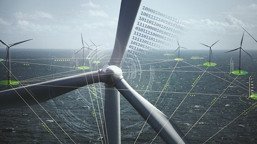 Parco eolico offshore che mostra più turbine eoliche collegate.