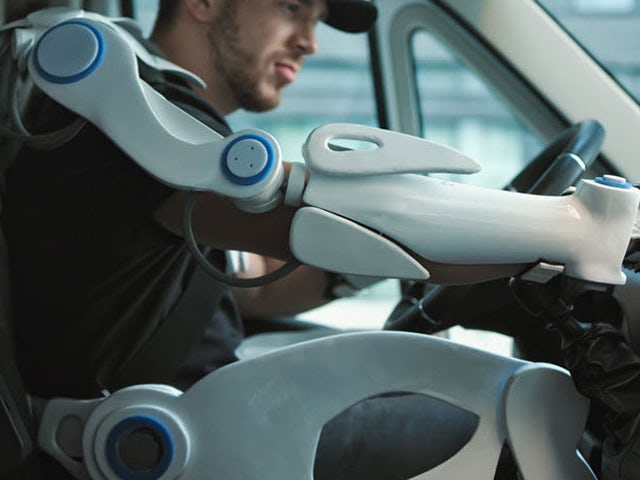 Prosthetic engineering is not new, yet prosthetic devices remain out of reach for many. 
Image of a person driving a car wearing a prosthetic device.