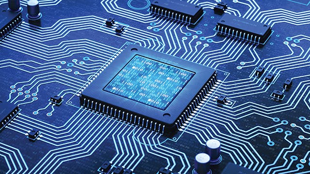  Close-up of a processor chip on a circuit board with blue background. 