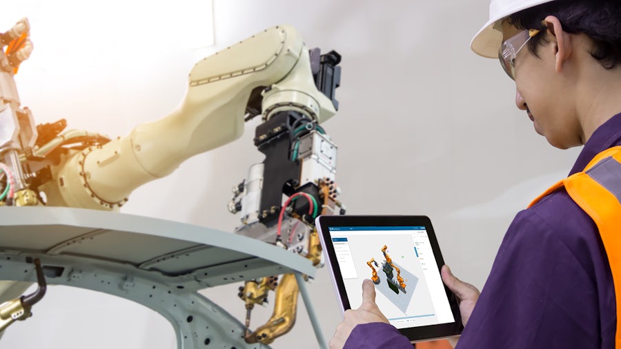 Man working on a robot tablet