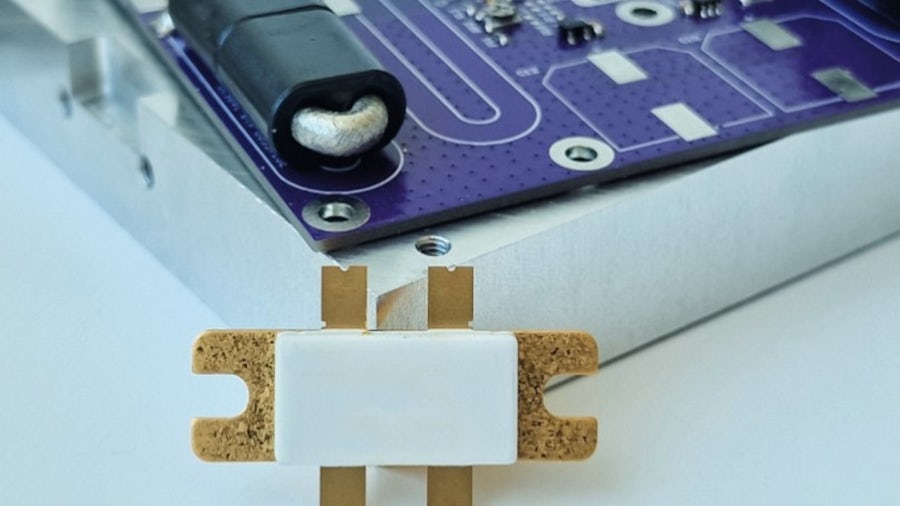 RF (Radio Frequency) power transistor or amplifier component mounted on what looks like a circuit board or test fixture