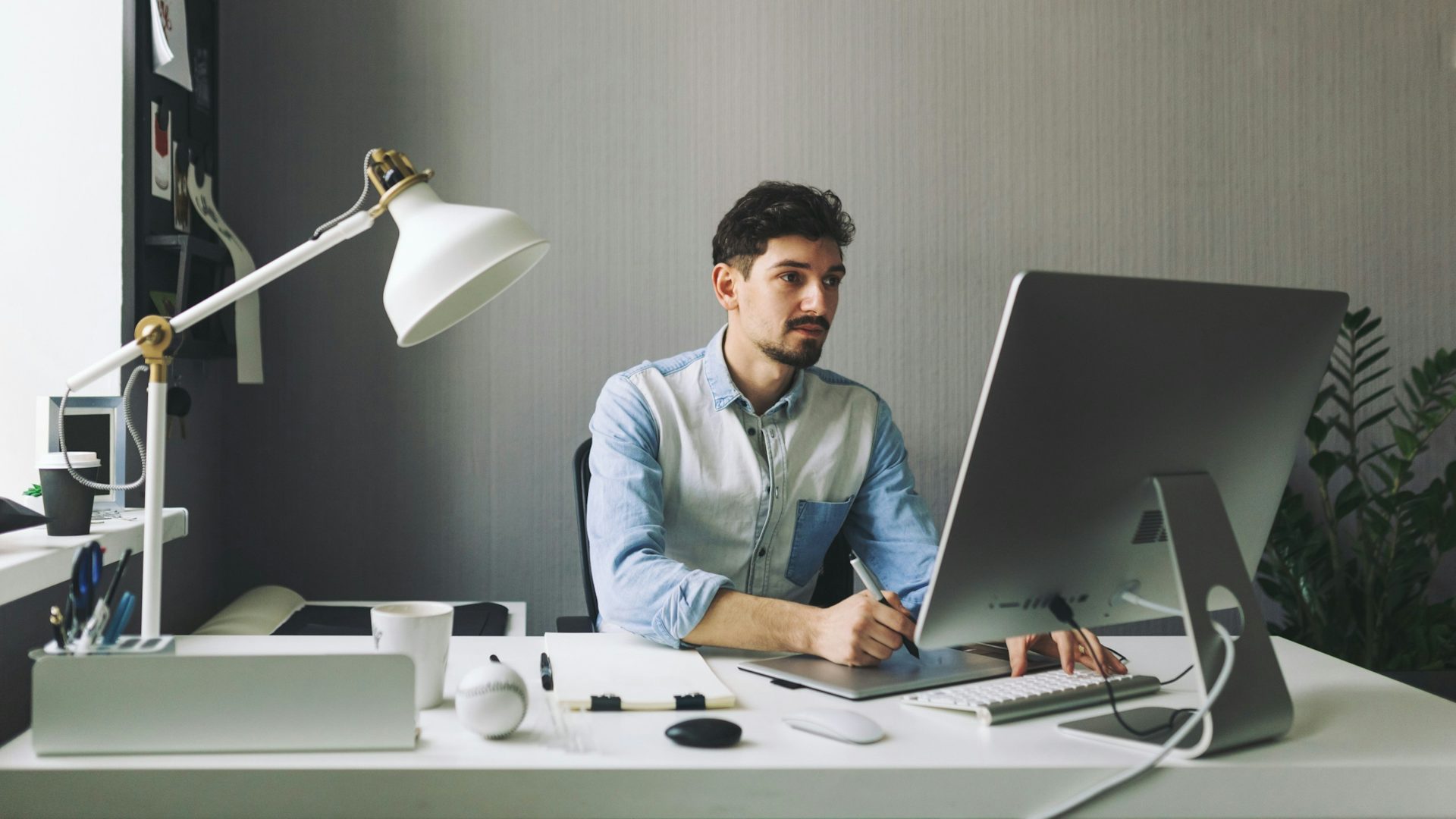 Person working on a design on a computer.