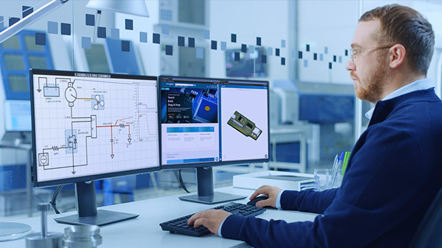 PCB design engineer on a computer using PartQuest.