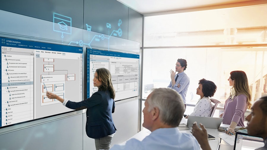 Lady demonstrating Opcenter in a classroom setting