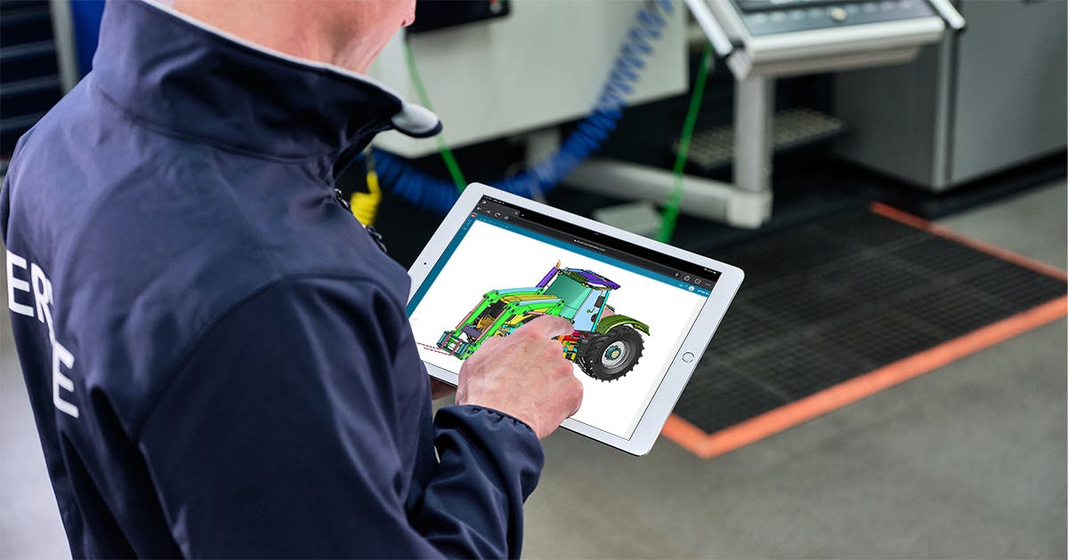 man looking at NX design from tablet