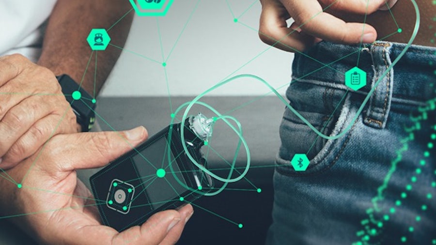 Two people showing the digital relationship of smart, connected medical devices 