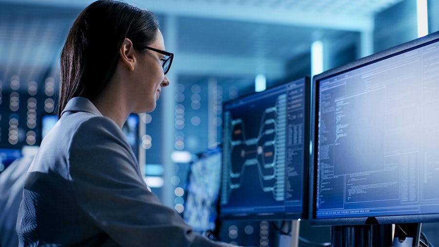 Woman looking at Teamcenter x on computer screen 