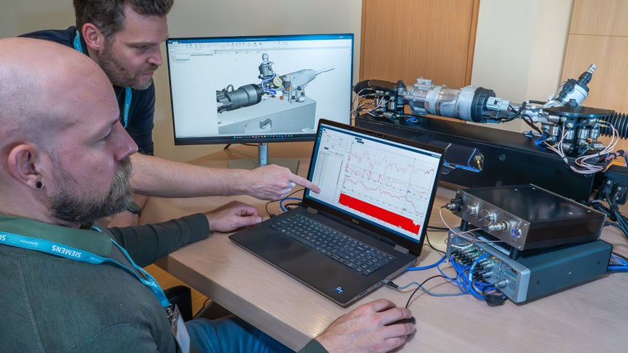 Engineers running Simcenter for automated component model extraction of blocked forces of an automotive steering system