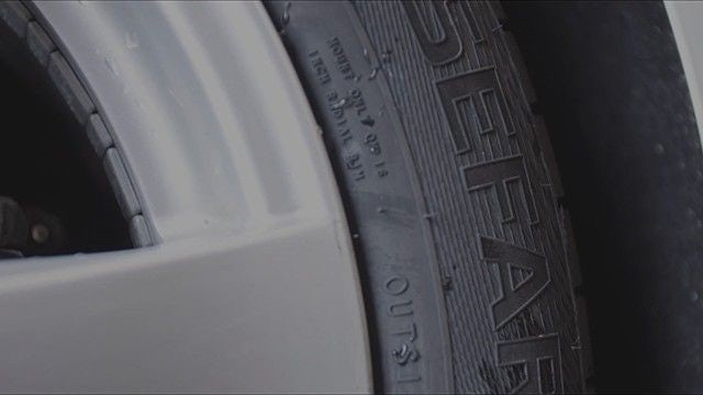 A cropped image of a car tire