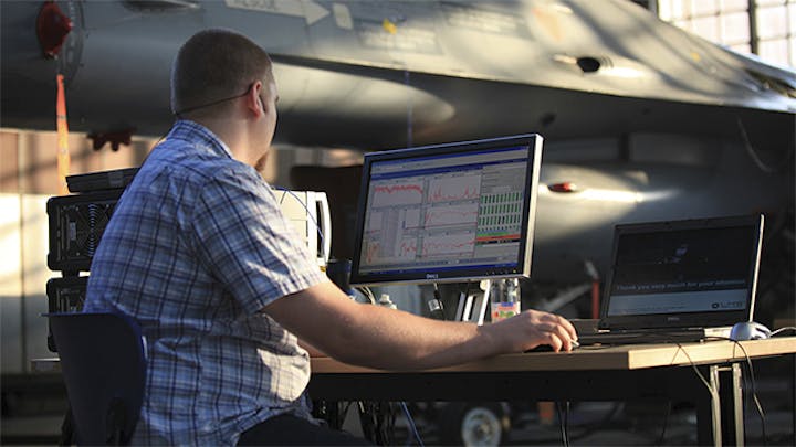 An engineer using Simcenter software for ground vibration testing.