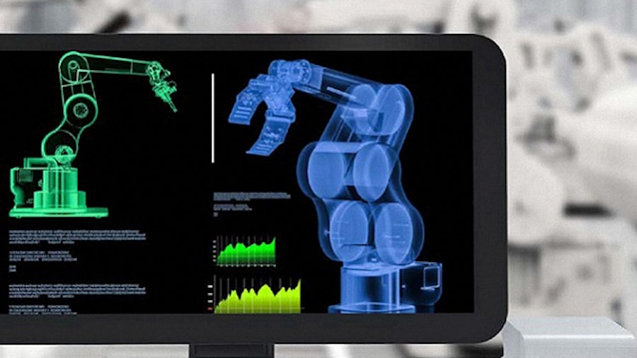 The low-code program Mendix on a computer screen in an industrial machinery setting. 