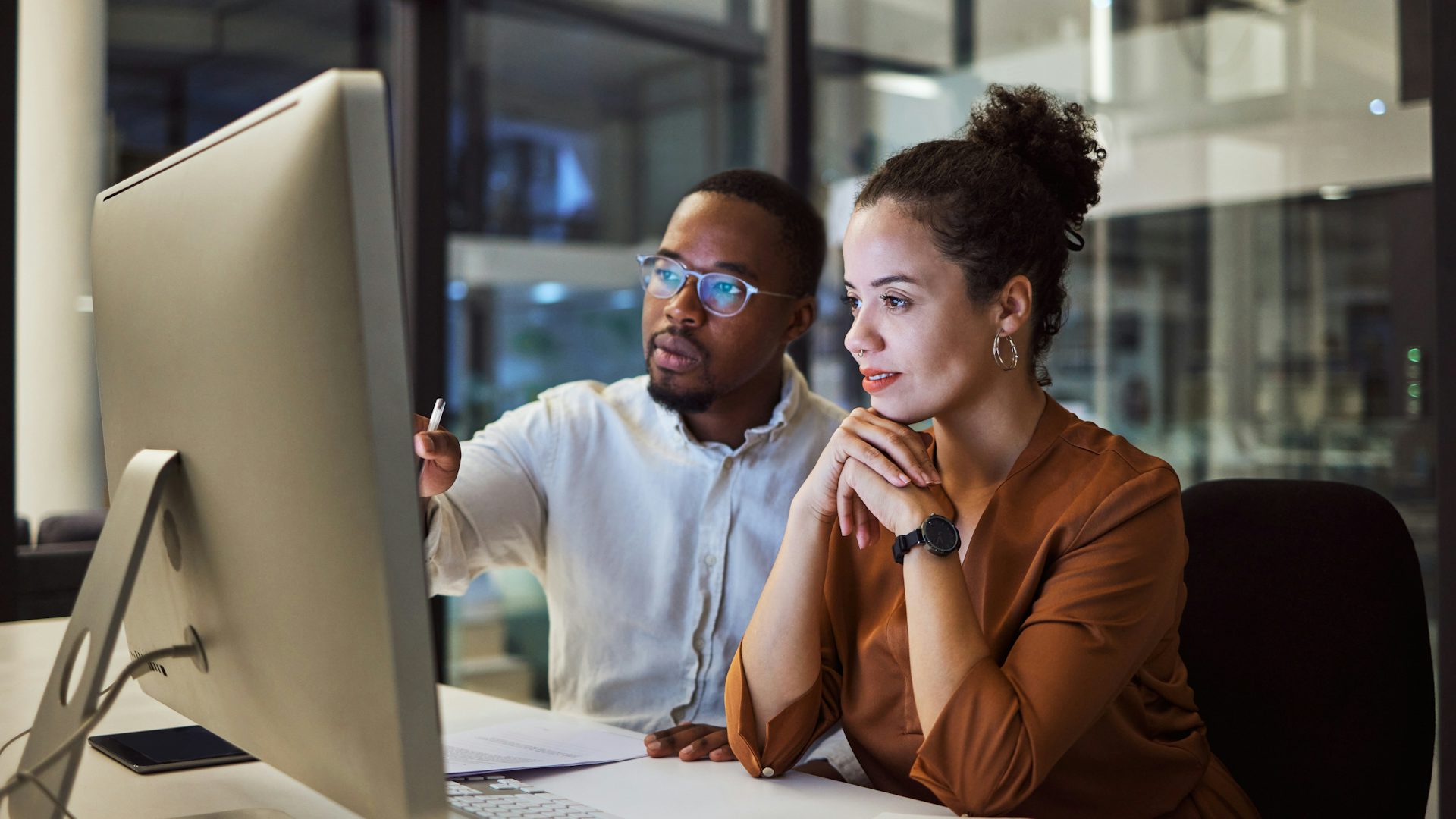 Woman and Man looking a computer screen