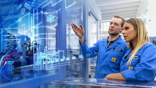 Two people observe a virtual factory superimposed on a manufacturing line representing the use of industrial IoT solutions for operational efficiency