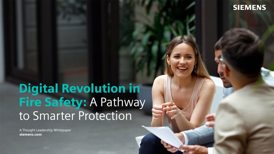 Three colleagues discussing, with a text overlay: Digital Revolution in Fire Safety: A Pathway to Smarter Protection