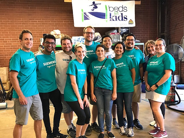 Siemens Strategic Student program working at beds for kids’ event 