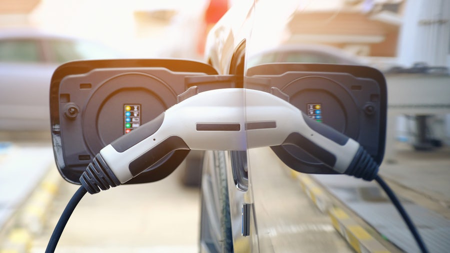A close up of an electric vehicle charging port