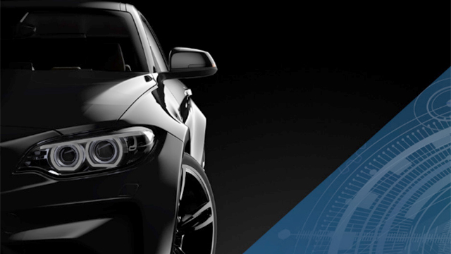 A black car next to part of a digital schematic