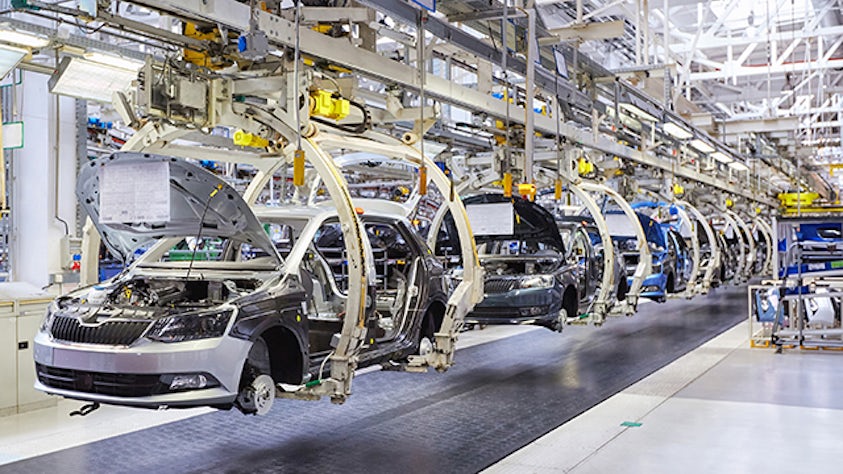An automotive assembly line in a factory.
