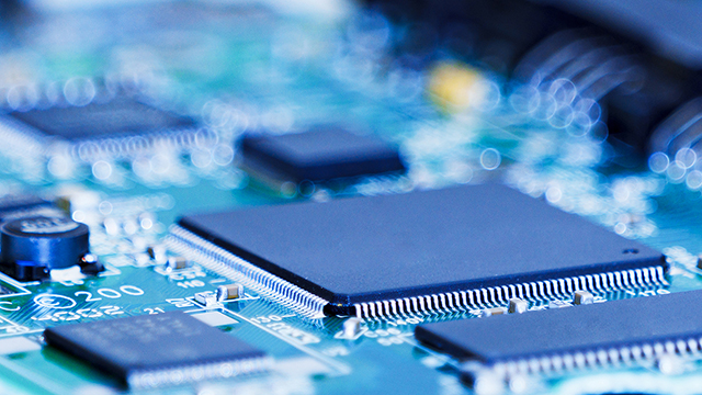 Chips on a motherboard with blue background