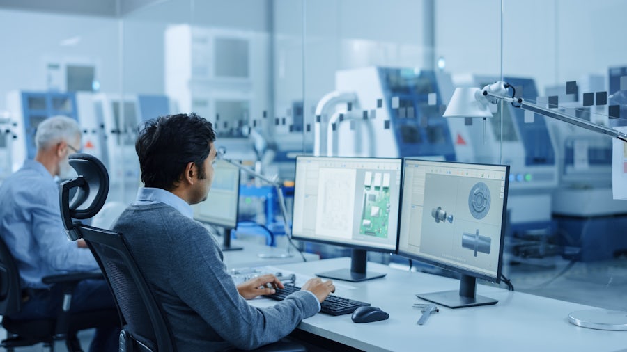 Men working on computers