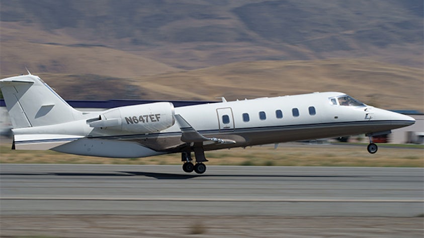 A jet is taking off on a runway.