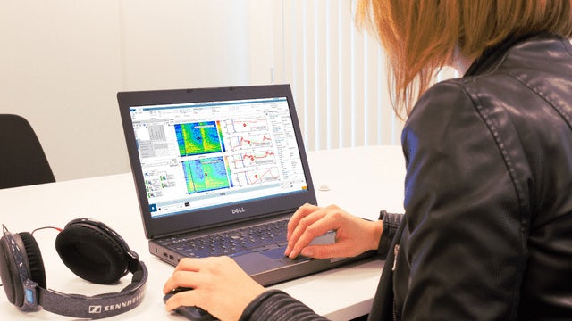 A woman using the Simcenter software on a screen.