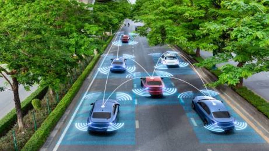 Six autonomous vehicles driving in a residential area.