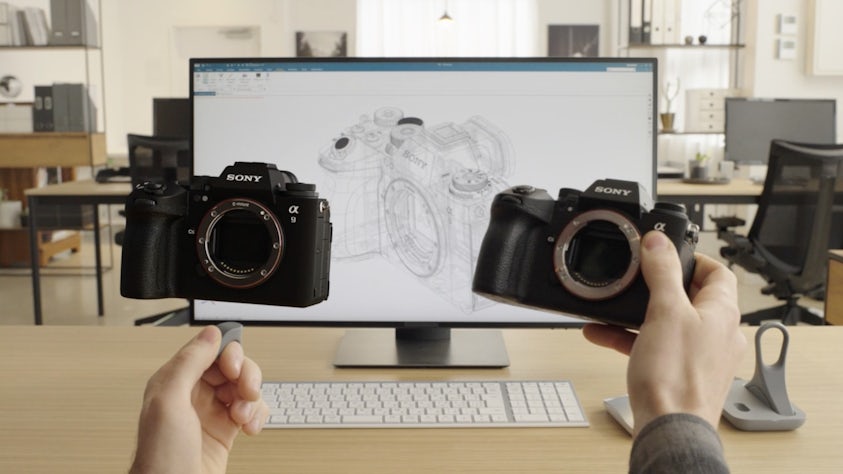 An engineer holding a real, physical SONY camera and 