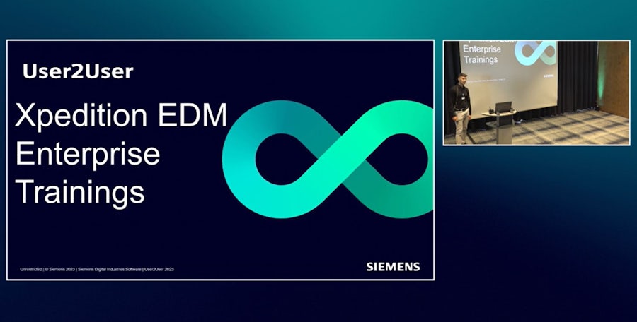 Siemens presentation slide titled "User2User Xpedition EDM Enterprise Trainings" with turquoise infinity symbol on dark background. Small inset shows presenter at podium during Enterprise Trainings session.