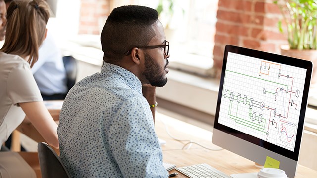 man on computer using PartQuest Promote