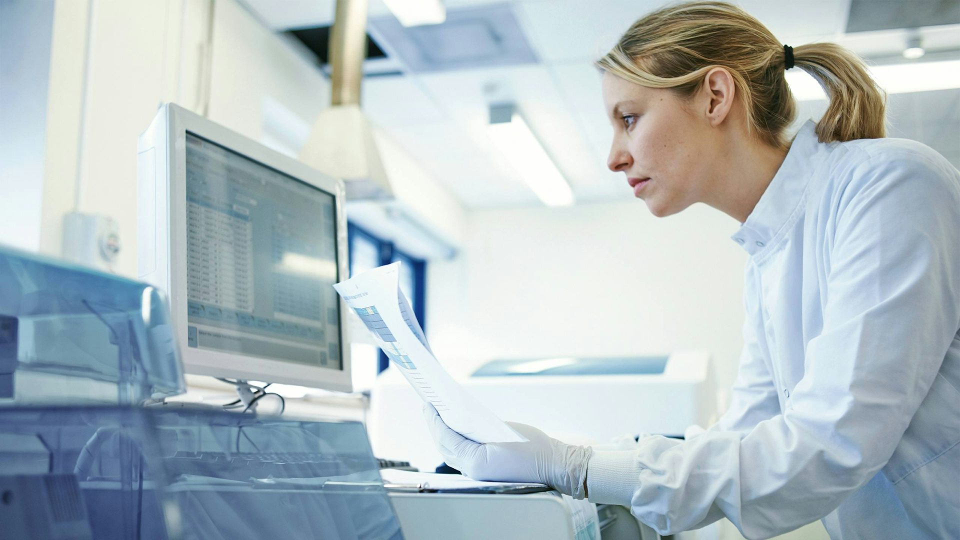 Woman in a lab on a computer.