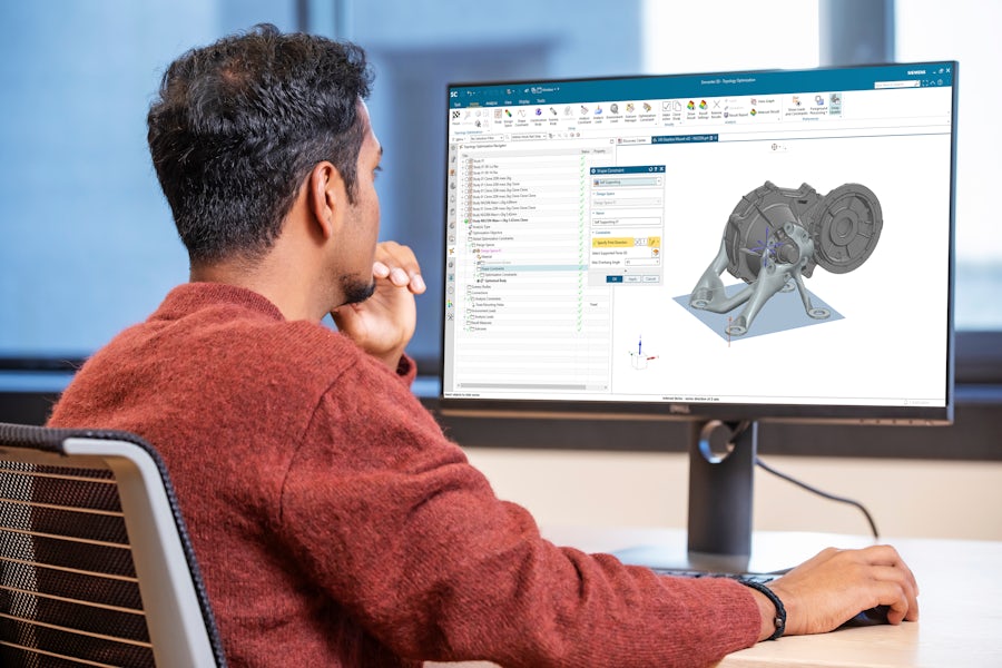 An engineer performing generative engineering using Simcenter 3D on her computer.
