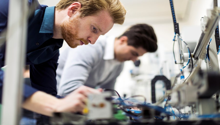 Engineers debugging hardware in the lab.