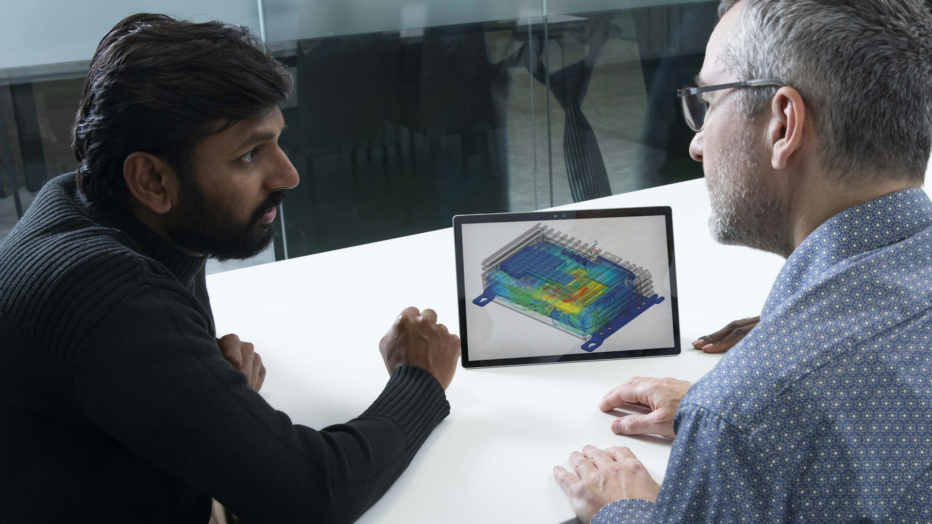 Engineers exploring Simcenter multiphysics simulation.