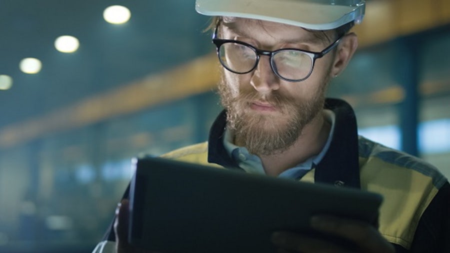 Operator analyzing data on tablet