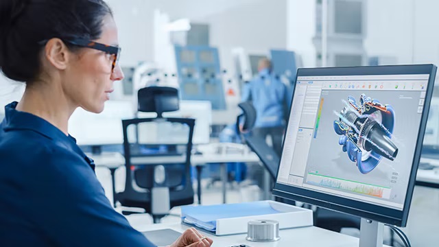 Woman viewing a 3D model of electric motor 