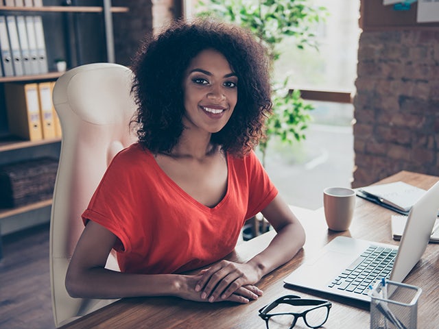 Woman working from home smiling