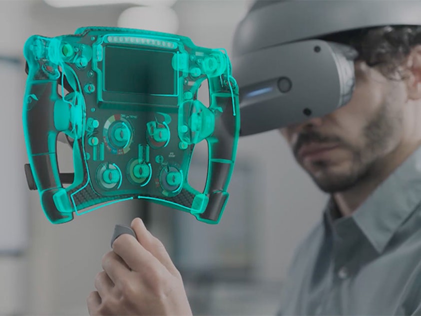 Engineers using Sony VR with Siemens NX Immersive Designer to work on a race car steering wheel.
