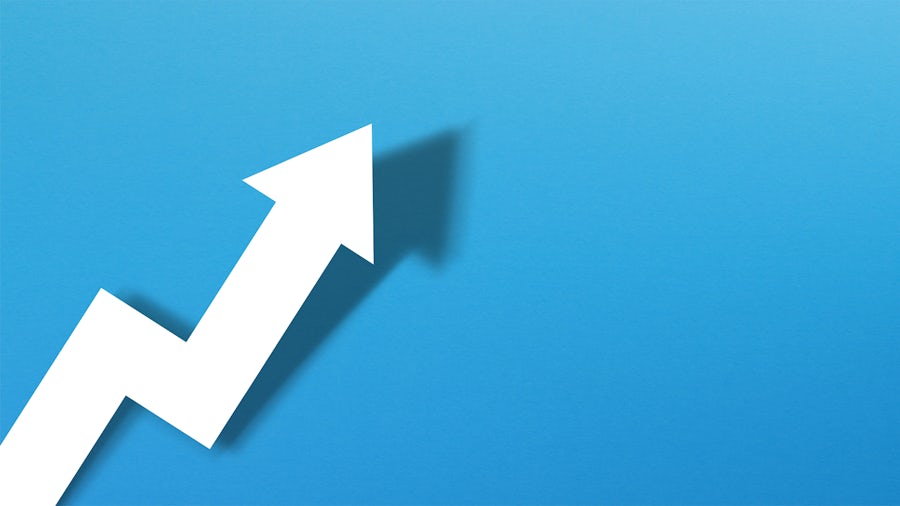 A graphic image of a white trend arrow going upwards and to the right over a blue background.
