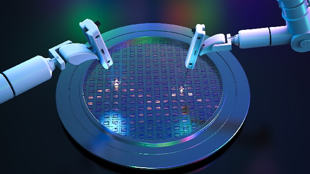 Two robot arms building computer chips