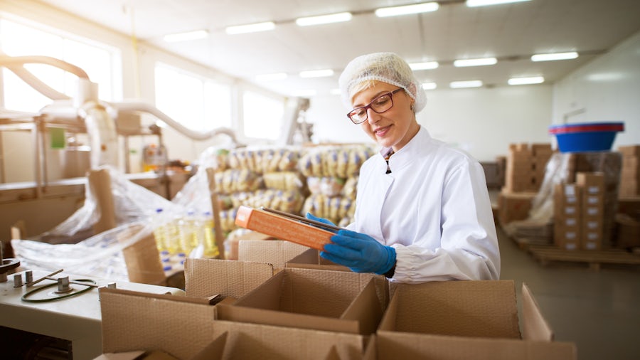 A woman working in supply chain in a medical device manufacturing facility.