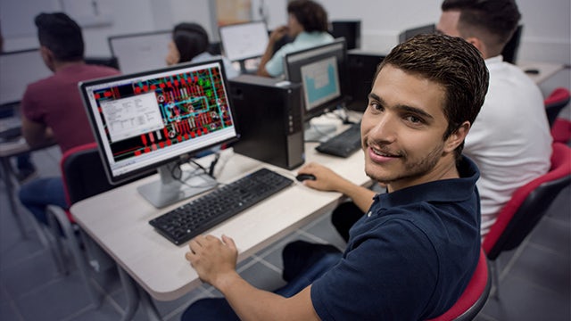 A student at a PC using PADS Professional Student Edition to hone his PCB design skills