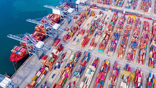An image of a ship yard with multi-colored containers