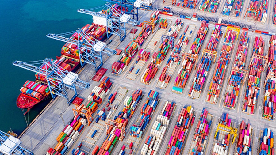 An image of a ship yard with multi-colored containers