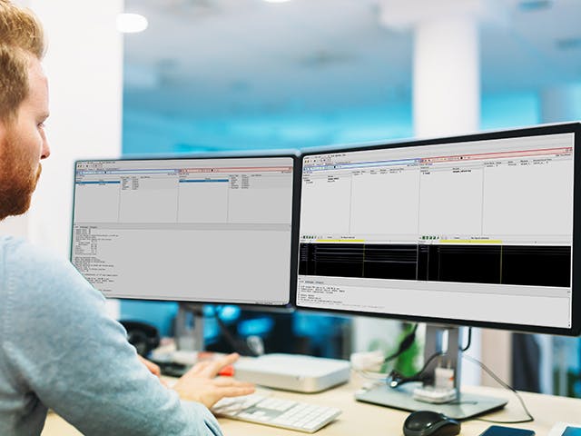 Engineer using Questa Equivalent FPGA on his desktop