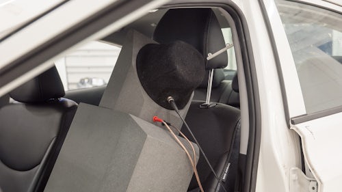 Simcenter low-mid frequency source unit is placed on a car seat.