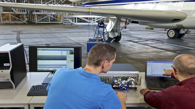 Engineers testing ground vibration for an aircraft with Simcenter solution.