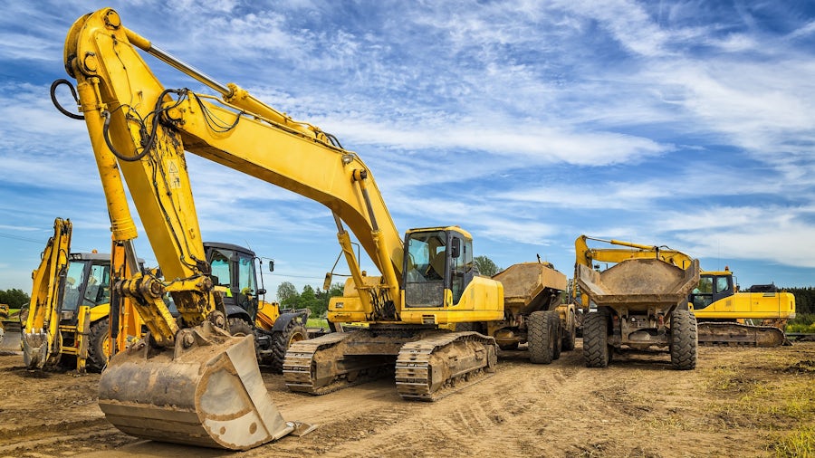 Heavy equipment in an outdoor setting with clouds