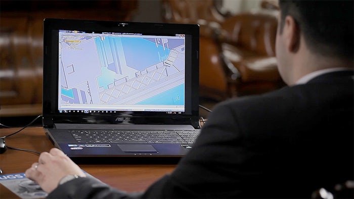 Student using CAD application on laptop computer
