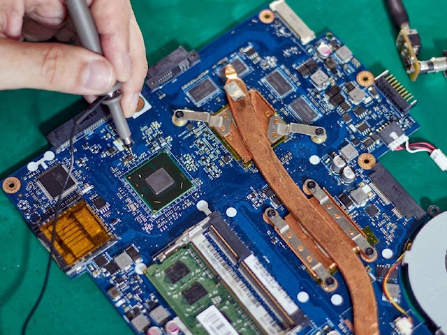 Debugging a computer board using a hardware probe.